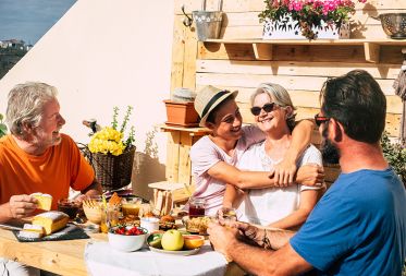 family shares a breakfast outside on a sunny day 2026 03 11 00 53 06 utc 1433e794