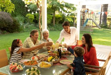 happy family toasting drinks during outdoor meal 2026 03 25 02 56 40 utc1 c74c3b7a